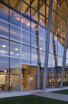 the outside of an office building with glass walls