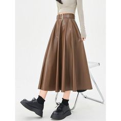 Discover Timeless Elegance Step into the world of sophistication and style with our Elegant High-Waist Faux Leather Skirt. This exquisite piece, perfect for the autumn and winter seasons, combines elegance with a contemporary twist, making it a must-have for your wardrobe. Crafted for the modern woman, this skirt is not just a garment; it's a statement of style and confidence. Product Features Our skirt boasts a classic A-line silhouette, ensuring a flattering fit for all body types. The high wa Black And Khaki, Skirt With Belt, Cardigan Sweater Vest, Evening Outfits, Faux Leather Skirt, Khaki Color, Winter Wear, Winter Season, Autumn And Winter