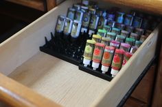 an open drawer filled with lots of different types of inks and markers on it