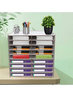 an office desk with many files and pencils on it