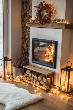 a living room with a fire place surrounded by candles