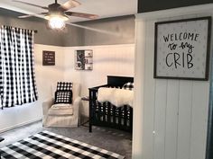 a baby's room decorated in black and white