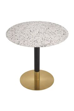 a white and black table with gold base