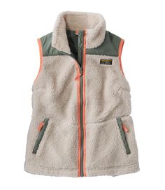 Enjoy both coziness and style with our Sherpa Fleece Vest, featuring the loved plush softness and warmth - with flattering waist and scalloped hem. Slightly Fitted. Best with midweight layer. Falls at hip. Center back length: Petite 23. 5", Regular 24. 5", Plus 26. 25". Body: 100% recycled polyester. Woven overlay: 100% nylon. Body lining: 100% recycled polyester. Machine wash and dry. Two front hand pockets. Our bestselling Sherpa Fleece, in a stylish vest. Modern hip-length with scalloped hem. Men's Fleece Vest, Fleece Vest Women, Womens Sherpa, Mens Sherpa, Sherpa Vest, Mens Apparel, Outerwear Vest, Fleece Vest, Mens Fleece