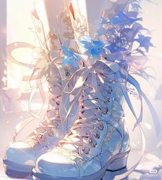 a pair of white boots with blue flowers on them