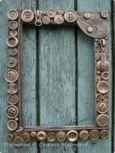 a metal frame with buttons in the shape of a square on a wooden background photo