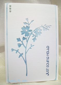 a white card with blue flowers on it