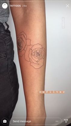 a woman's arm with a rose tattoo on the left side of her arm