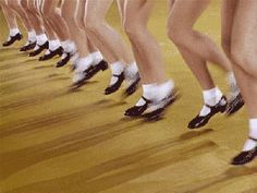 a group of women in short shorts and white socks are lined up on the floor