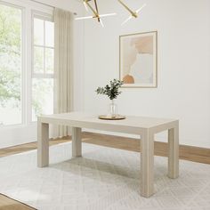 a white table sitting on top of a wooden floor