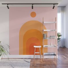 an orange and pink wall mural in a living room with a ladder to the right