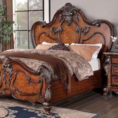 an ornate wooden bed frame in a bedroom