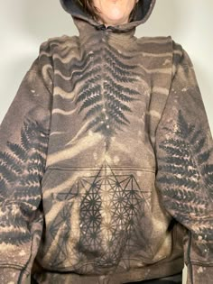 "READY TO SHIP !!  Size XL pull over heavy weight fleece bleach dye hoodie with Fern on front with a Tetrahedron on the kangaroo pocket, the back displays a fern and a Merkabah. The sleeves have ferns reaching up the arms mirrored on both front and back and the hood features a mirrored image Merkabah. X-Large measures 26\" width/ 30\" length/ 34\" sleeve.  Cotton/polyester blend. Bleach dyes hoodies are all hand dyed by myself. Due to the creative process of bleach dyeing,  no two garments will Bleaching Hoodie, Bleach Sweatshirt Diy, Diy Hoodie Refashion, Creative Hoodies, Bleach Dye Hoodie, Bleach Dye Sweatshirt, Goblin Clothes, Tired Person, Bleached Hoodie