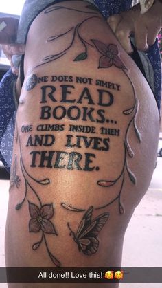 the back of a woman's thigh with an old book quote tattooed on it