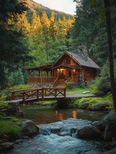 a small wooden cabin sitting on top of a lush green forest next to a river