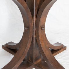 a wooden table with two circular bases