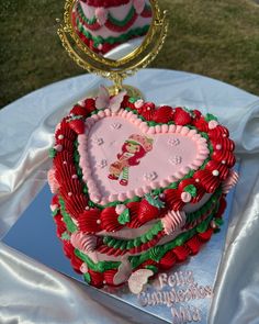 a heart shaped cake on top of a table