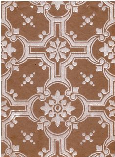 a brown and white tile pattern with small circles in the center, on top of a tan background