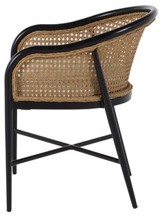 a chair made out of wicker with black legs and an armrest, on a white background