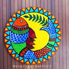 a colorful bird painted on the side of a wooden wall next to a sign that says supratihanthiri