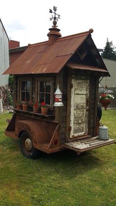 an old truck with a little house on the back