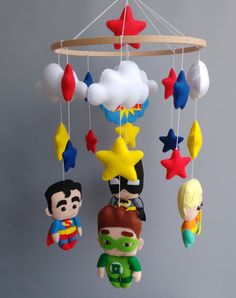 a baby mobile with toys hanging from it's sides and stars on the ceiling