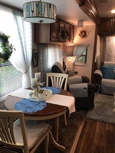 a living room and dining area in an rv