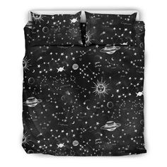 black and white bedding with stars, planets and saturns on the night sky