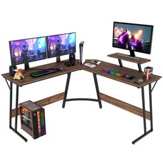 a computer desk with two monitors and a keyboard on it, sitting next to each other