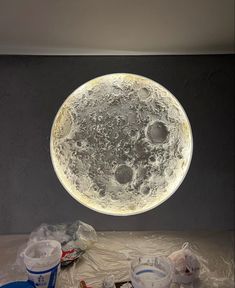 a full moon is shown in the middle of a room with plastic wrap around it