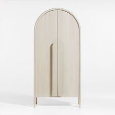 an arch shaped cabinet with the door open