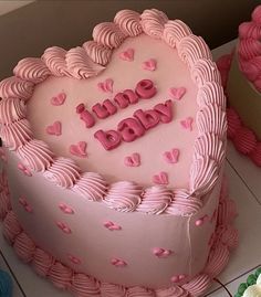 two heart shaped cakes sitting on top of a table