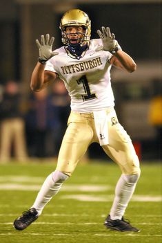 a football player throwing a ball on top of a field