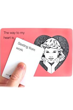 a hand holding a card with an image of a woman's face