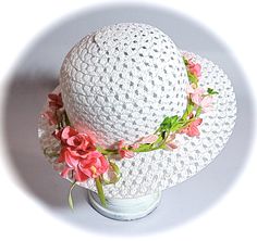 "This little girls Easter bonnet or tea party hat is a white open weave sun hat with a wired leaf green garland that wraps the crown.  The garland is sprinkled with velvet flowers in shades of pink.  The hat is perfect for Easter or a flower girl in a garden wedding!  This hat measures 20-1/2\" at the crown...be sure to measure mid forehead before ordering!  To view my entire collection of Girl's Hats click on this Section.... https://www.etsy.com/your/shops/Marcellefinery/sections/16935555 Prev Handmade White Brimmed Mini Hats, Spring Beach Crochet Hat With Flower Shape, Adjustable Sun Hat For Spring Gift, Spring Gift Adjustable Sun Hat, Spring Sun Hat With Curved Brim, Spring Sun Hat With Curved Brim As Gift, Brimmed Sun Hat For Spring, Spring Gift Sun Hat With Curved Brim, Spring Garden Party Crochet Hat With Wide Brim