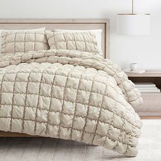 Upgrade your bedroom with the unique, modern style of this Neutral Puff 3-pc. Full/Queen Comforter Set. Its warm, neutral design will elevate any decor style! Set includes one (1) comforter and two (2) pillow shams Comforter measures 90W x 90L in. Pillow sham measures 26L x 20H in. Crafted of polyester with polyester fill Quilted puff design Hues of tan OEKO-TEX® certified. Care: Dry clean only. This item is available at Kirklands.com only, not available in stores. Please note: this item cannot be shipped to APO/FPO addresses. | Full/Queen Comforter Set, 3 Piece, Tan, Full/Queen, Polyester | Kirkland's Home Puff Comforter, Daybed Cover Sets, Quilted Comforter, Linen Comforter, Modern Style Bedroom, Puff Quilt, Neutral Bedding, Daybed Covers, Lush Decor