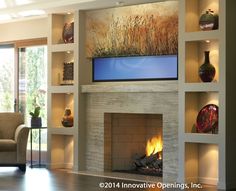 a living room filled with furniture and a fire place in front of a flat screen tv