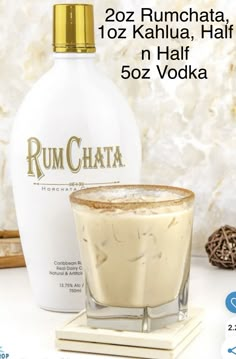 a bottle of rumchata next to a glass filled with ice cream and cinnamon