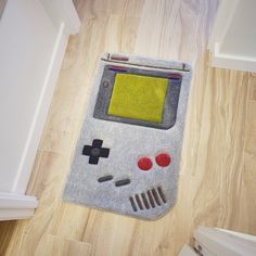 a nintendo game boy rug on the floor