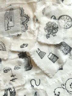 several pieces of cloth with pictures on them