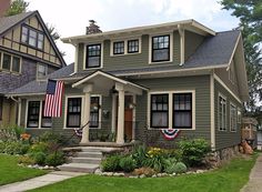 a house with an american flag on the front porch