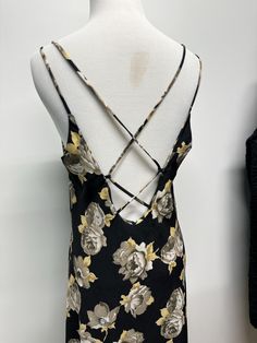 Vintage 90s black floral slip dress with corset style back.  The perfect 90s slip dress!  Tag reads, San Souci, 100% polyester, dry clean only, made in the USA, large.  Mint vintage condition with normal wear due to age.  measurements: Length- 57 inches  Bust- 36 inches  Waist- 34/35 inches  Hips- 48 inches  Please note that vintage size labels do not reflect modern sizing. All measurements are taken with the garment laying flat, doubled for the bust, waist and hips. Be sure to allow some wiggle Slip Dress With Corset, Slip Dress Corset, Slip Dress Style, 90s Slip Dress, Style Corset, Dress With Corset, Dress Corset, Floral Slip Dress, Corset Style