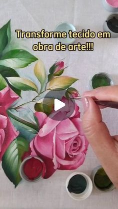 someone is painting flowers with acrylic paint on a tablecloth that says transforme tecido em abra de arte