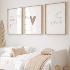 a bedroom with two framed pictures above the bed