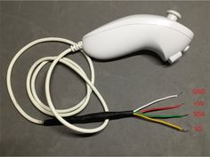 a white cord connected to an electronic device