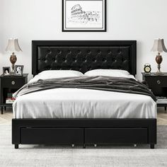 a black bed with white sheets and pillows