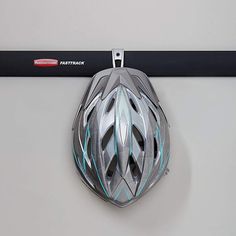 there is a helmet hanging on the wall