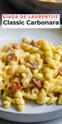 macaroni and cheese with bacon on a white plate