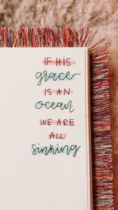 an open notebook with the words if this grace is an ocean we are all sinking