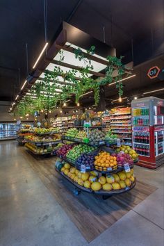 a produce section in a grocery store filled with lots of fruits and veggies